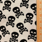 Black Skulls on White Cotton Lycra Fabric